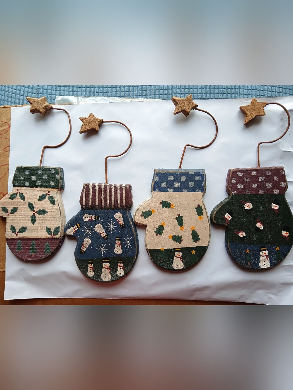 set of 4 vintage rustic wooden mitten ornaments from LTD. Each wooden mitten